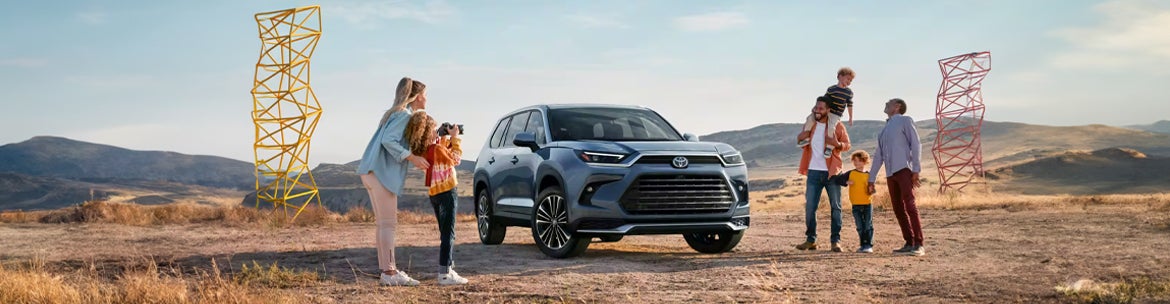 image of a family with a Toyota SUV