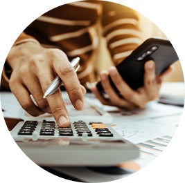 image of a person using a calculator