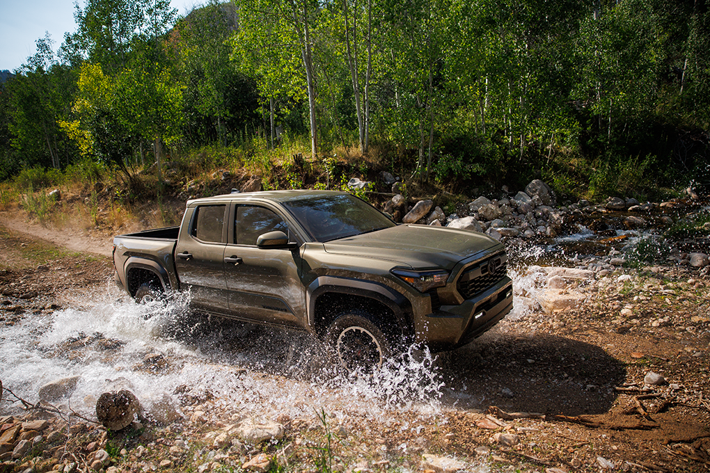 Toyota Tacoma loaded with construction materials at a jobsite demonstrating cargo capacity, durability, and everyday work-truck utility