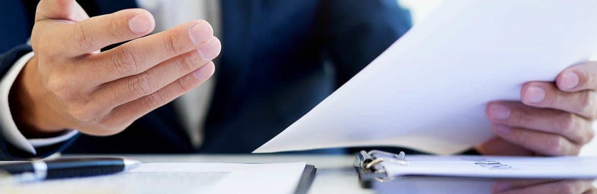 image of sommeone reviewing something on paper